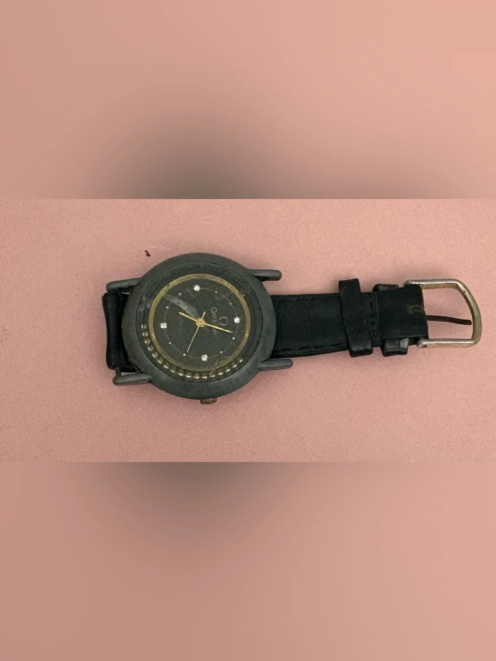 Omega Black Dial Watch with Gold Accents and Crystal Markers